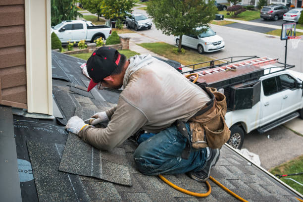 Professional Roofing technician working in East Kingston, NH